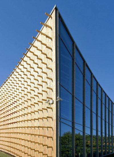 modern-university-buildings-wooden-beams-projecting-from-a-curved-wood-cladding.jpg